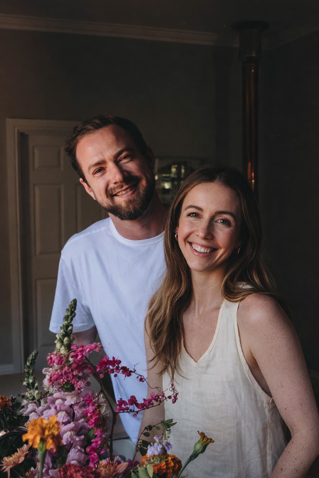 Pippa and Dylan together with an armful of flowers